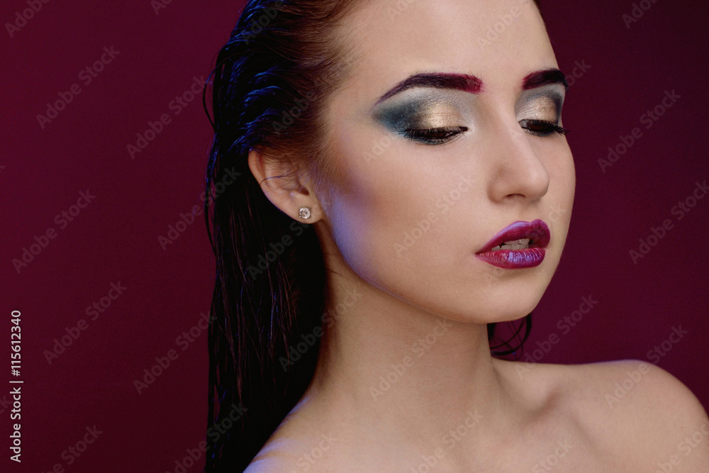 Fototapeta premium Closeup face of beautiful model with fashion bright makeup