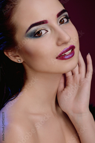 Closeup face of beautiful model with fashion bright makeup