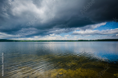 Storm clouds over Massabesic Lake, in Auburn, New Hampshire. © jonbilous