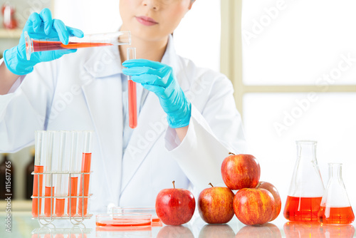 Asian female scientist testing genetic modification will be ok