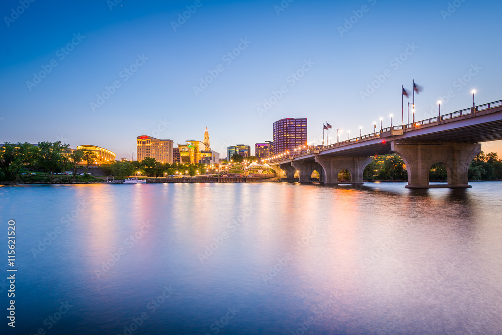 The downtown skyline and Founder's Bridge at sunset, in Hartford