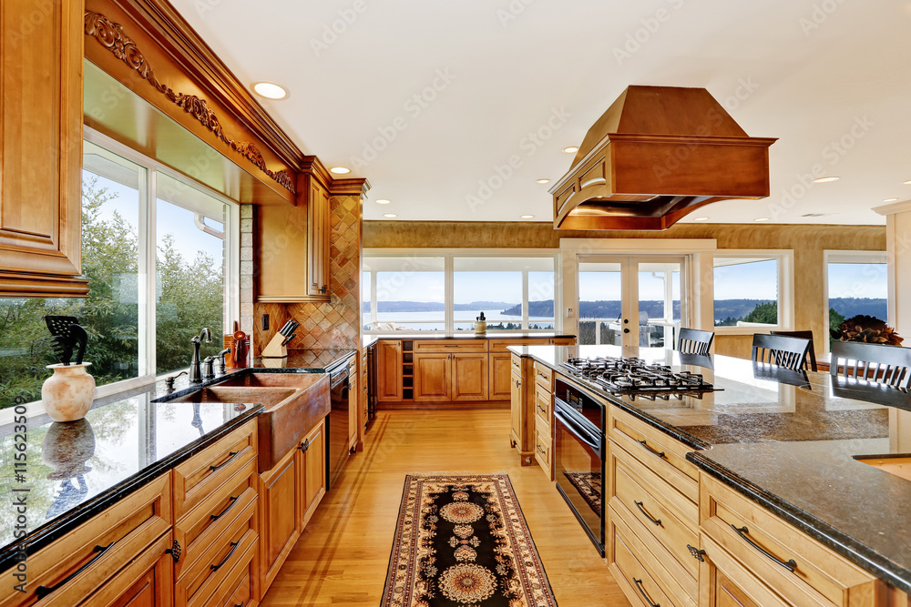 Luxury kitchen with water view, island and sink. Luxury kitchen with water view, island and sink.