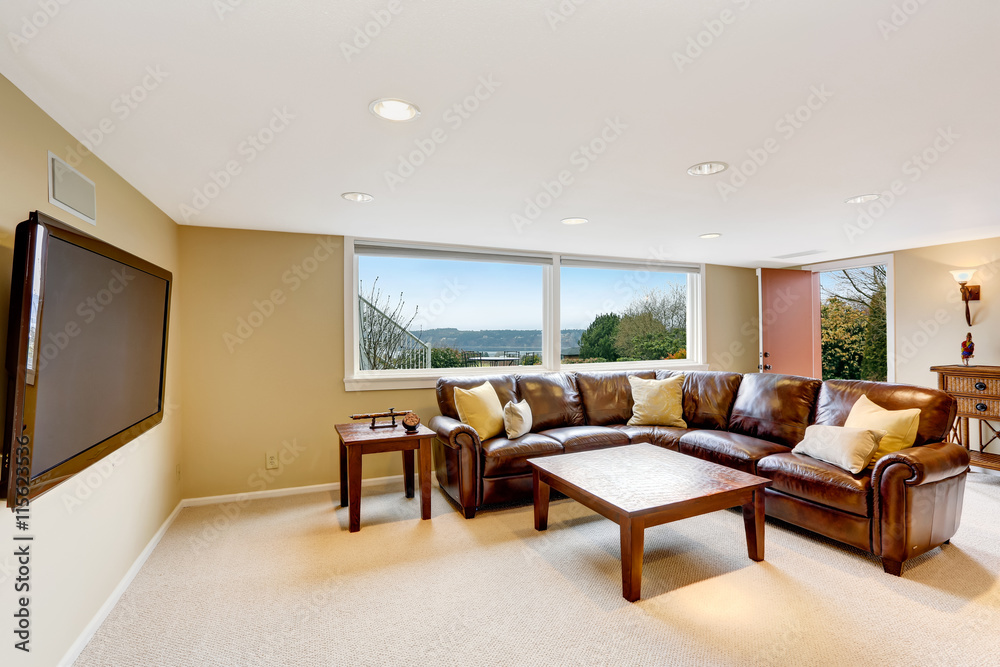 Large beige living room with leather sofa Large beige living room with leather sofa