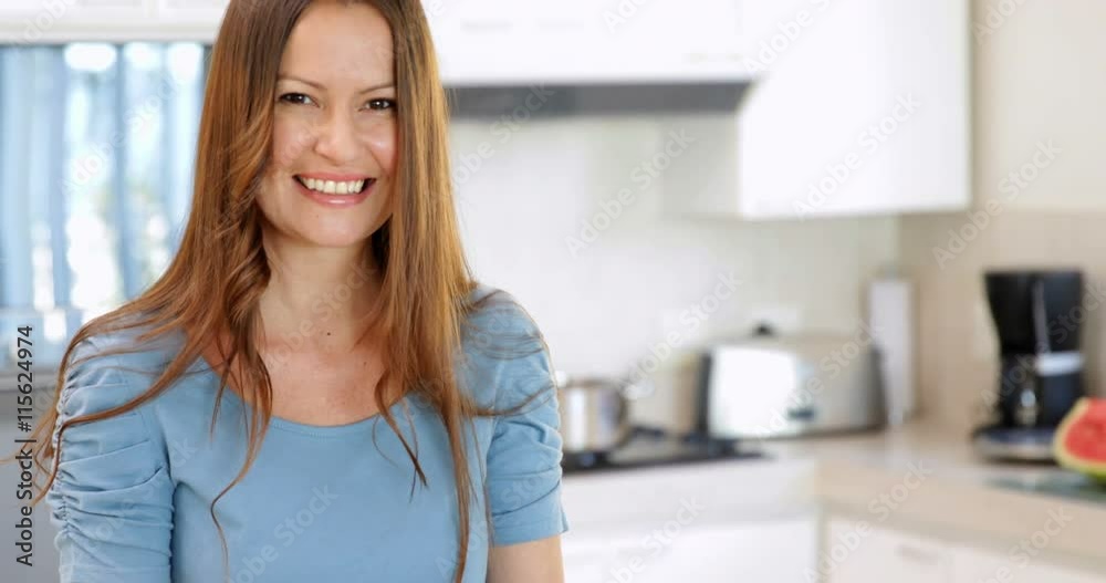 Smiling woman preparing vegetables on the chopping board Smiling woman preparing vegetables on the chopping board