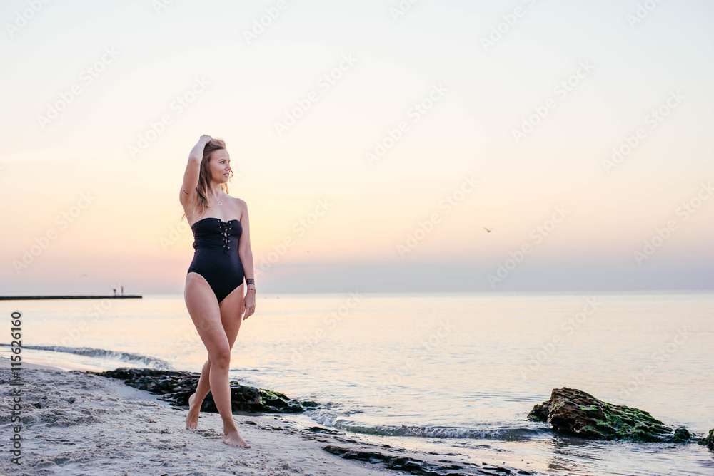 young beautiful woman having fun on beach