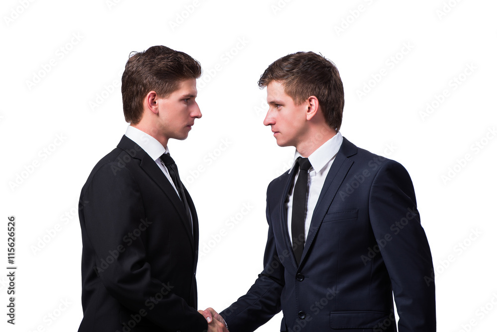 Two twin brothers handshaking isolated on white Two twin brothers handshaking isolated on white