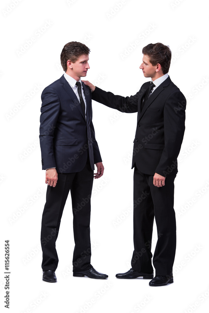 Two twin brothers handshaking isolated on white Two twin brothers handshaking isolated on white
