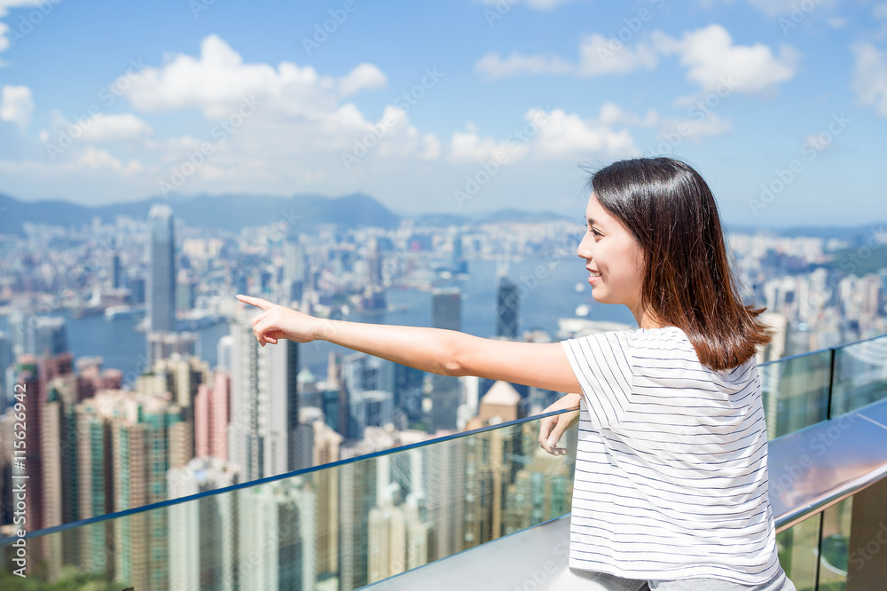 Woman finger pointing out the location in Hong Kong Woman finger pointing out the location in Hong Kong