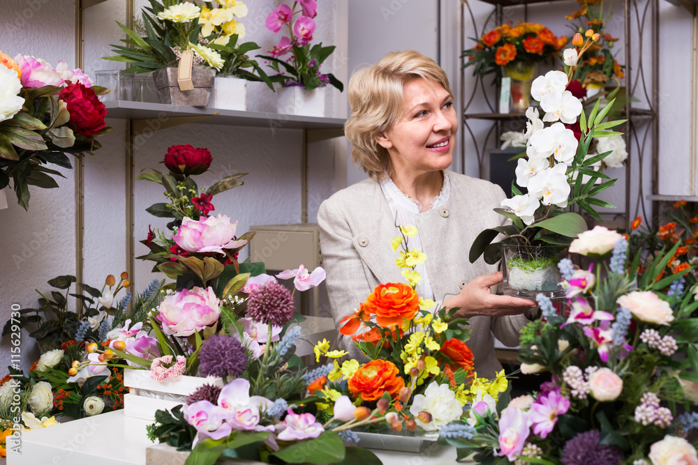 Mature female customer in floral shop.