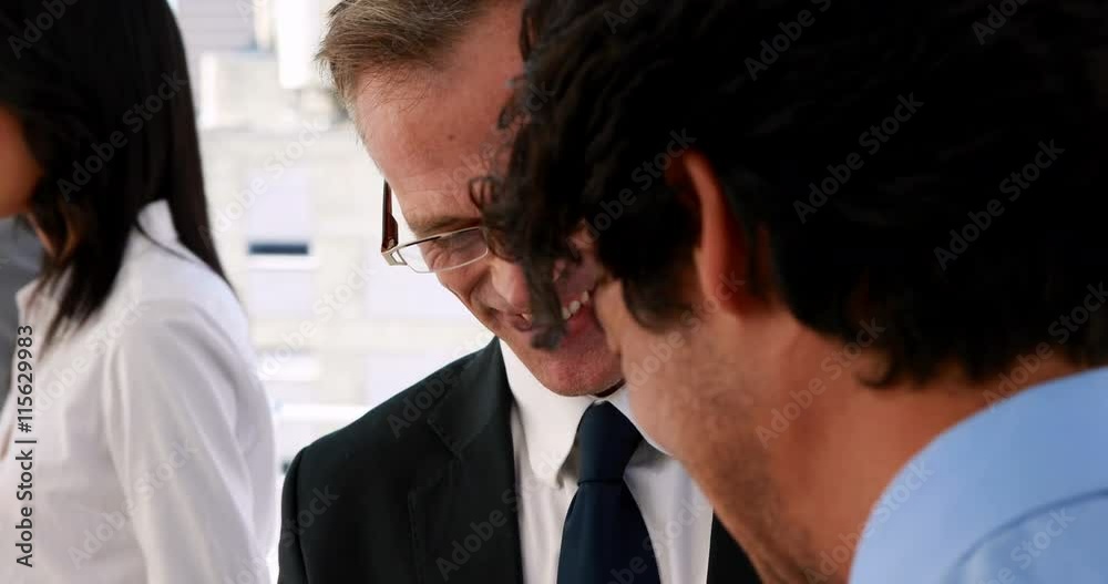 Business people standing and talking in the office Business people standing and talking in the office