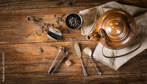 Konstfotografi Tea concept (dry tea and kettle), above view.