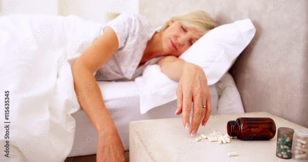 Woman lying motionless after overdose of pills Woman lying motionless after overdose of pills
