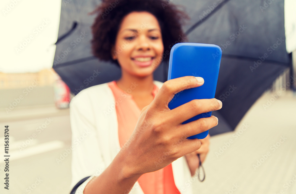 close up of woman with umbrella and smartphone close up of woman with umbrella and smartphone