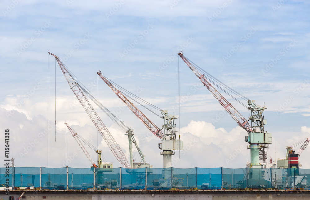 big shippingbuilding with a lot of crane in the gulf of Thailand