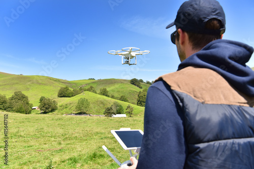 Man handling drone in nature photo