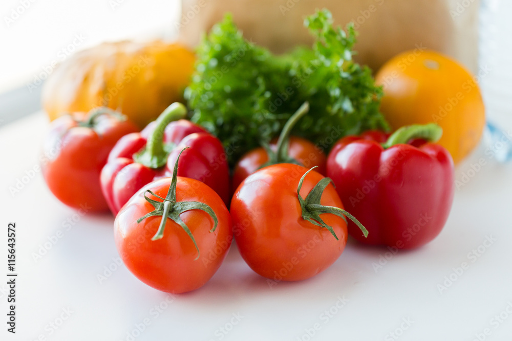 close up of fresh ripe vegetables on kitchen table close up of fresh ripe vegetables on kitchen table