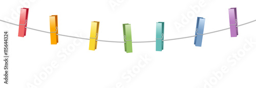 Colored clothes pins on a clothes line rope.