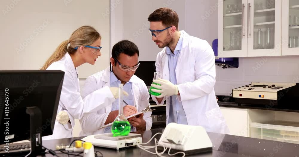 Young scientists working together in the lab in high quality 4k format