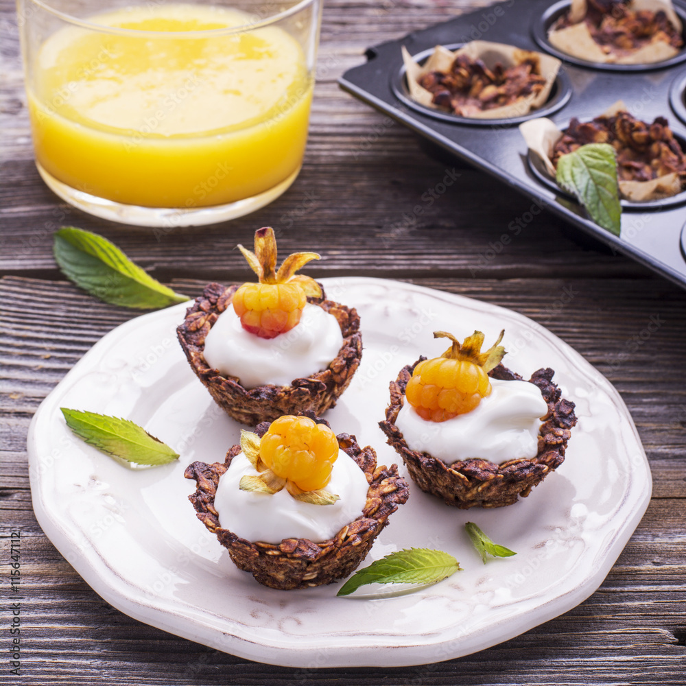 Granola cups filled with yogurt and fresh berries Granola cups filled with yogurt and fresh berries