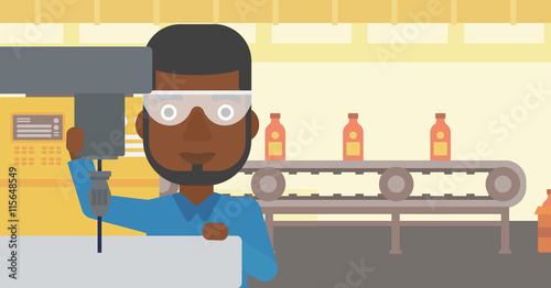 Man working on milling machine.