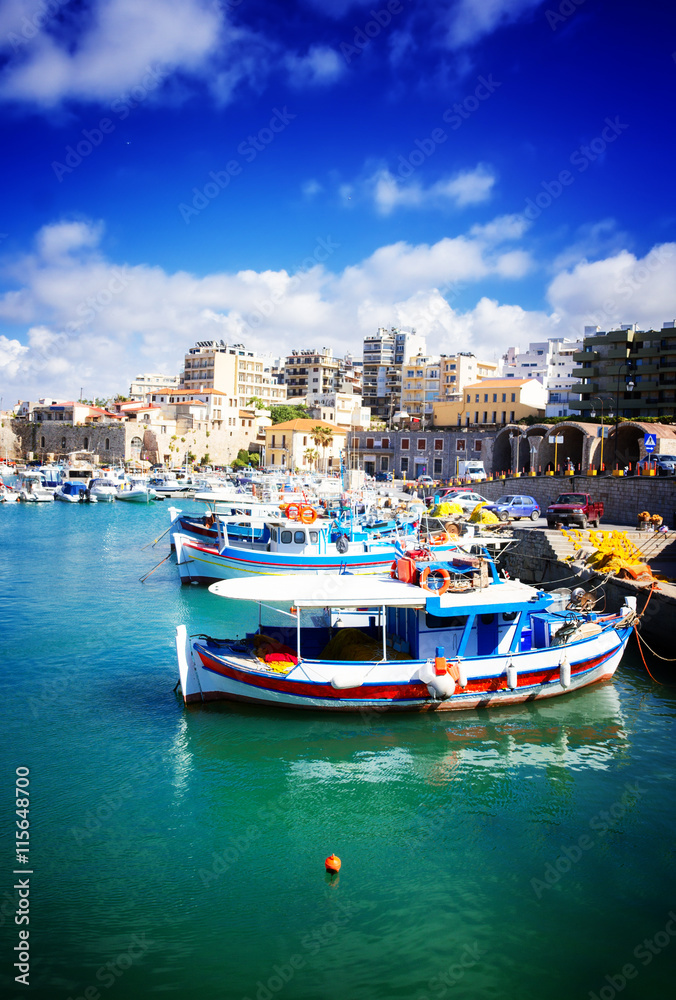 Heraklion old town port with colorful boats, at sunny day, Crete Greece, toned
