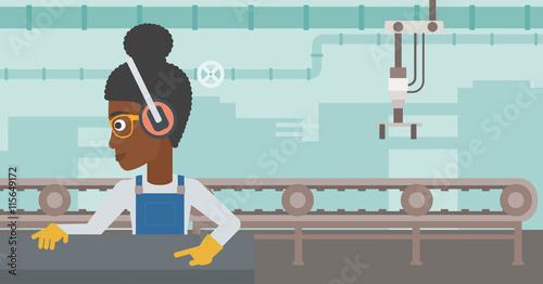 Woman working on metal press machine.