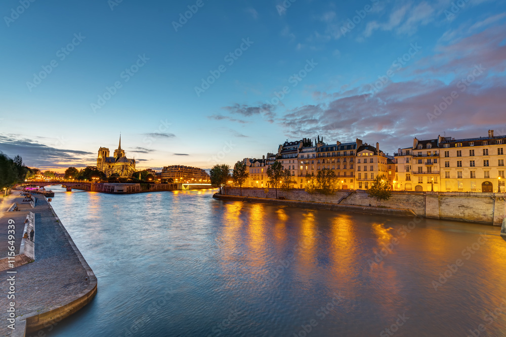 The river Seine with the Ile de la Cite and the Notre Dame Cathedral in Paris at dawn