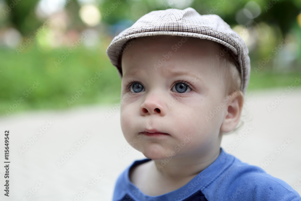 Serious child in cap Serious child in cap