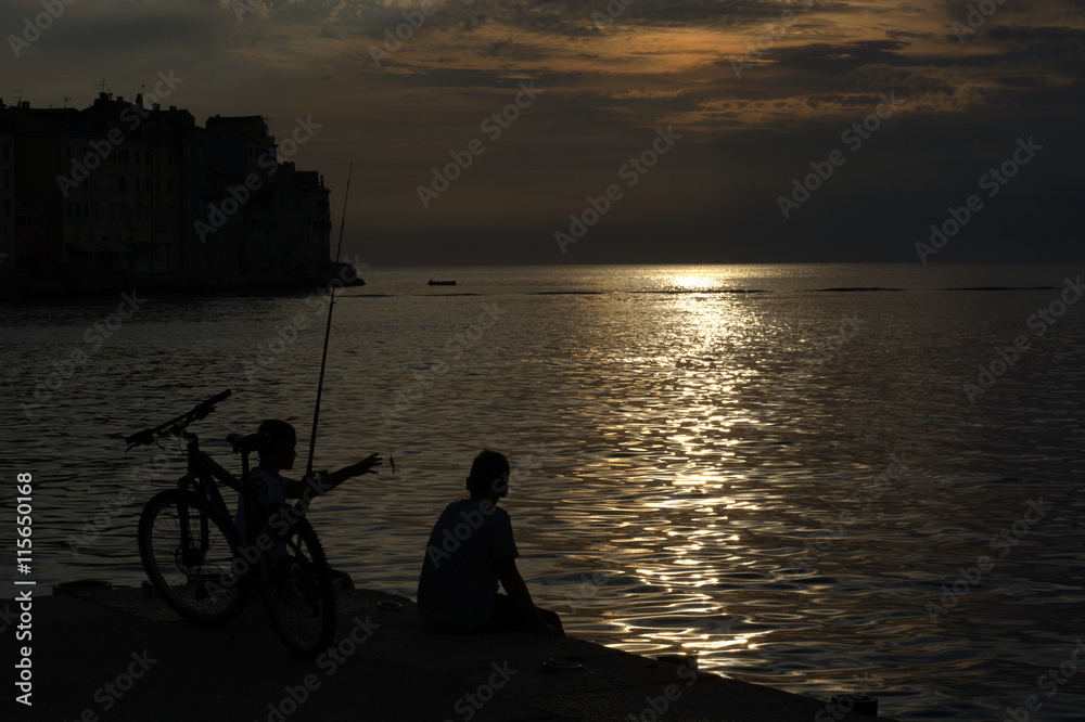 Fishermen at sunset on the Croatian coast