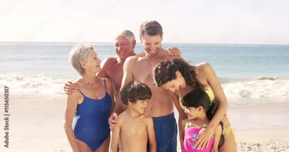Cute family standing on the beach in slow motion Cute family standing on the beach in slow motion