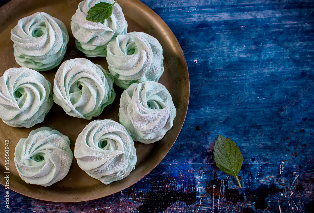 Marshmallow on the tray decorated by mint. Marshmallow on the tray decorated by mint.