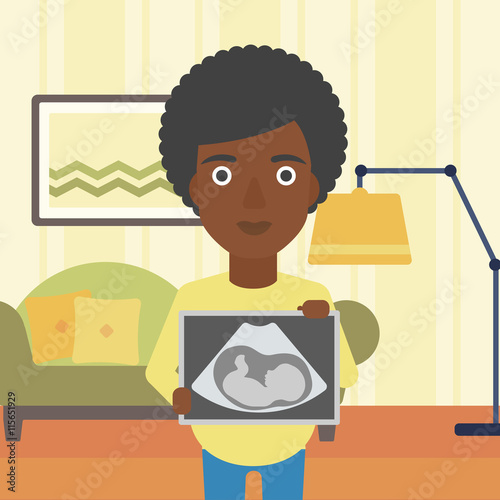 Pregnant woman with ultrasound image.