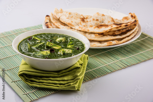 tasty palak paneer served with nan / naan / roti / chapati / fulka / tandoori naan / indian bread photo