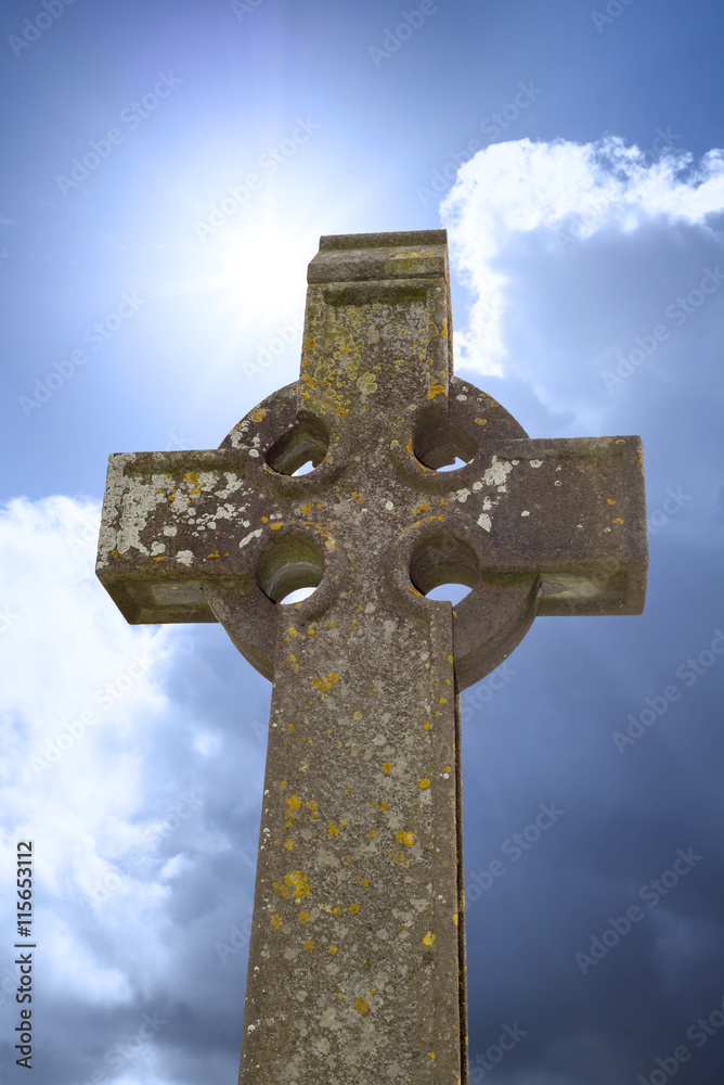 sunshine over celtic cross at ancient graveyard sunshine over celtic cross at ancient graveyard