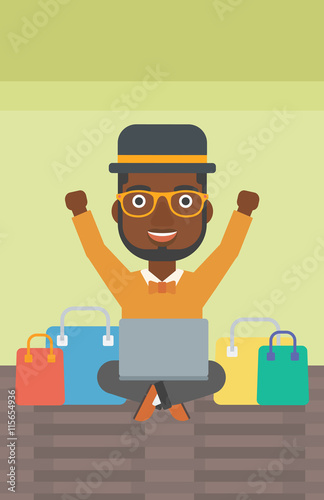 Man shopping online using his laptop.