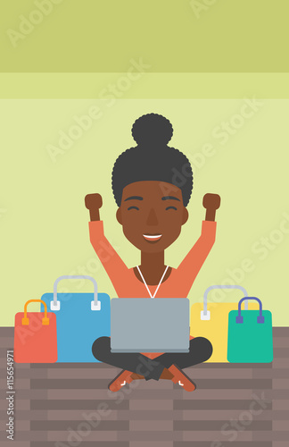 Woman shopping online using her laptop.