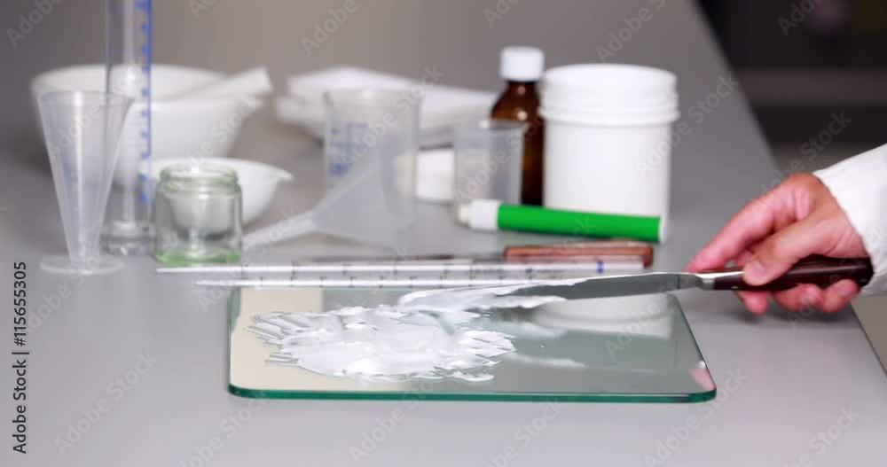 Scientist preparing a white paste