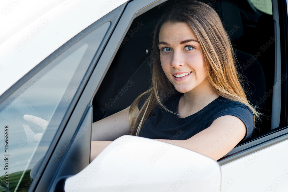 beautiful young woman in the car
