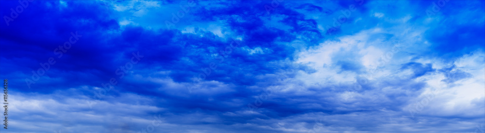 Fototapeta premium Horizontal wide panorama blue vivid cloudscape background backdr
