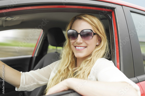 Woman in the car.