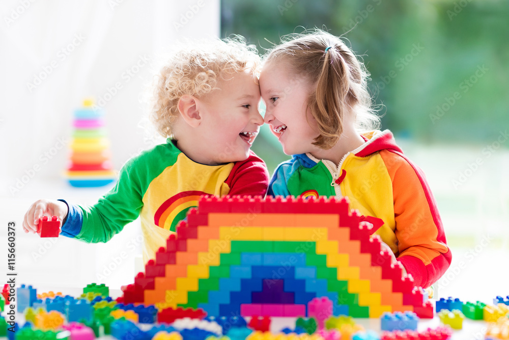 Fototapeta premium Kids playing with colorful blocks