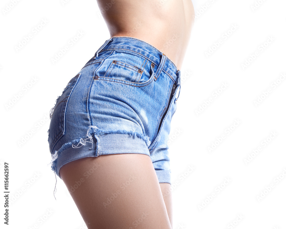Sexy woman in fashion blue jeans shorts. Perfect hot booty and erotic  curves hips. Good body shapes whithout cellulite. Sport and diet. Photos |  Adobe Stock