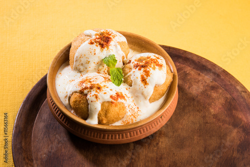 dahi vada or dahi bhalla, indian snacks, served with tamarind chutney photo