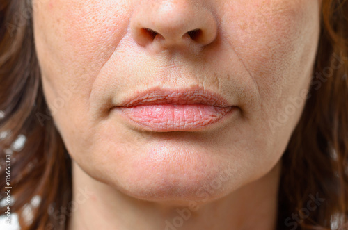 Obraz na płótnie Closeup on the mouth of a middle-aged woman