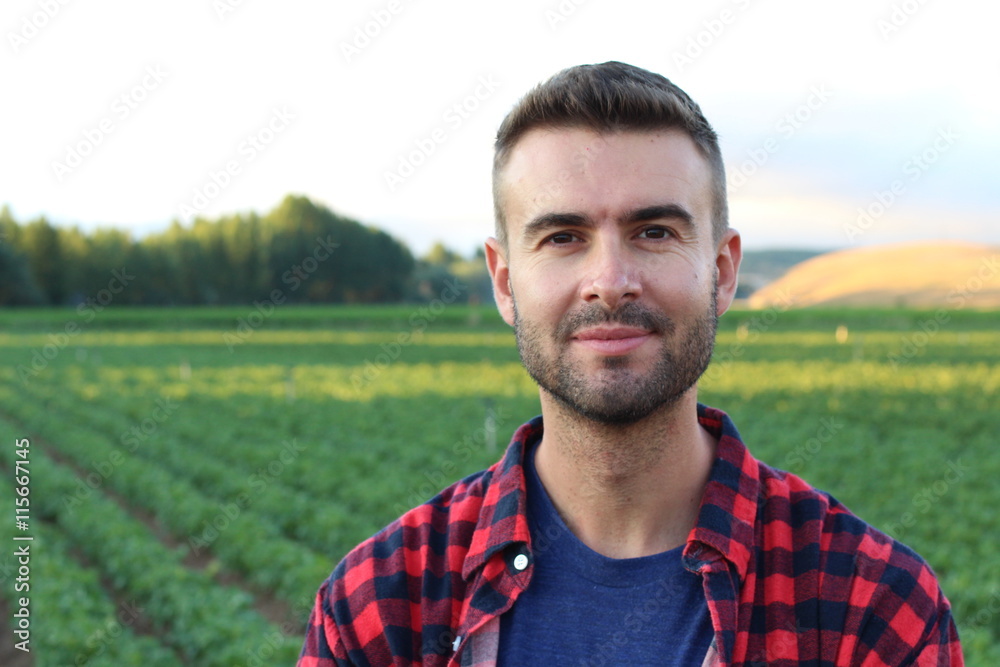 Fototapeta premium Handsome farmer standing proud and satisfied 