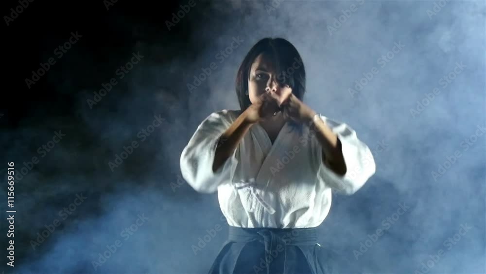 beautiful girl doing aikido, smoke, slow motion beautiful girl doing aikido, smoke, slow motion