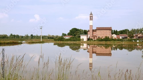 Little church reflecting in a rice field in Italy
 photo