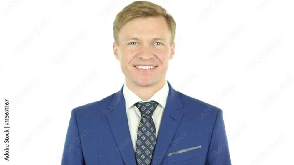 smiling businessman looking at camera with reliability isolated on smiling businessman looking at camera with reliability isolated on