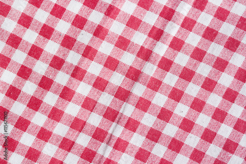 Red and white checkered picnic tablecloth background.
