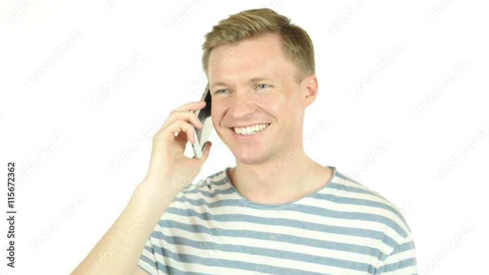Handsome designer talking on phone, white background Handsome designer talking on phone, white background